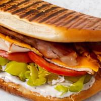 (3) Turkey Bacon Ranch · Turkey, bacon, cheddar, tomato, pickles, pepperoncini and ranch dressing.