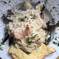 Risotto Mare · Mussels, clams, shrimp, scallops in wine sauce.