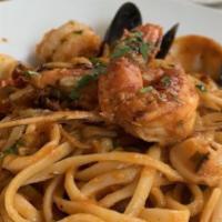 Linguine Frutti Di Mare (Pescatore) · Mussels, clams, calamari, scallops, shrimp, herbs and spicy tomato sauce.