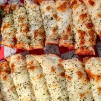 Garlic Cheese Bread · Our fresh baked Italian bread brushed with olive oil and garnished with garlic and Italian h...