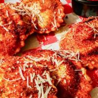 Toasted Ravioli · 7 pieces of Ravioli. All cheese and filled with ricotta and Italian herbs. Coated with Itali...