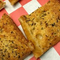 Garlic Toast · Our fresh baked Italian bread brushed with olive oil and garnished with garlic and Italian h...