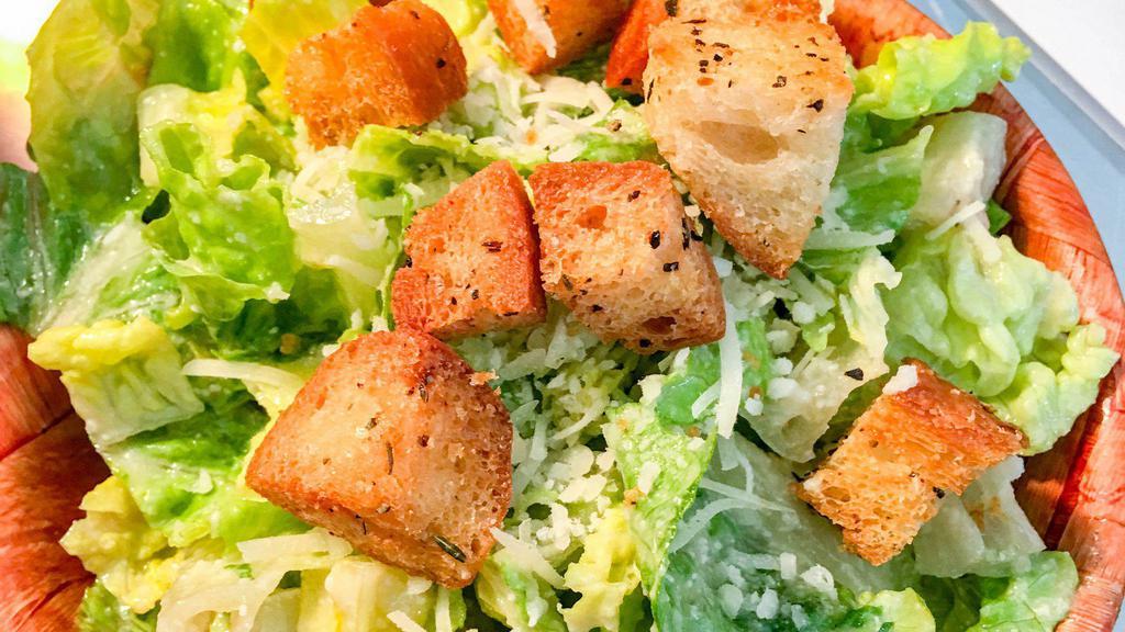 Caesar Salad · Fresh Romaine lettuce with homemade caesar dressing, croutons, and shaved Parmesan cheese.