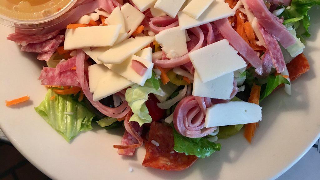 Jovito'S Italian Salad · House salad with Italian dressing, pepperoni, sliced ham, salami, and Provolone cheese.