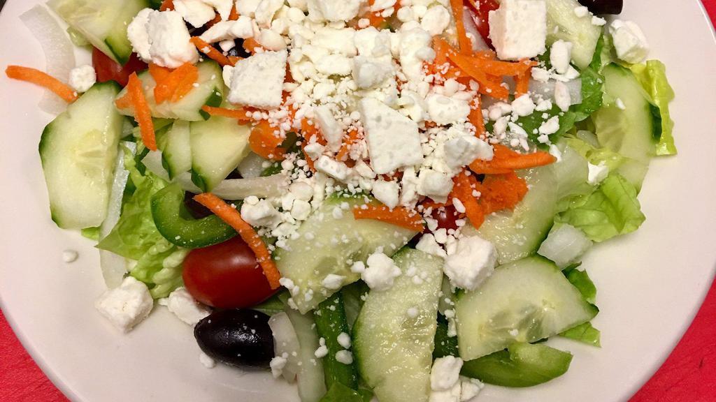 Greek Salad · Romaine lettuce, Feta cheese, kalamata olives, cucumbers, tomato, onion and green peppers, carrots, with balsamic vinaigrette.