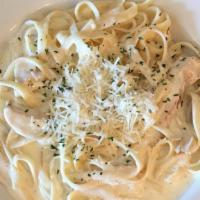 Chicken Fettuccine Alfredo · Fettuccini noodles with Alfredo sauce that contains organic cream, grilled chicken, grated p...