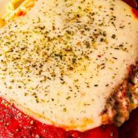 Chicken Parmesan Over Pasta · Thinly pounded chicken breast that is breaded with Italian bread crumbs. Stove top fried and...