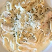 Fettuccine Alfredo · Fettuccini noodles with Alfredo sauce that contains organic cream, grated pecorino cheese, a...