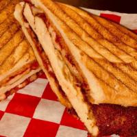 Chicken Parmesan Panini · An Italian roll with a thinly pounded chicken breast that is breaded with Italian bread crum...