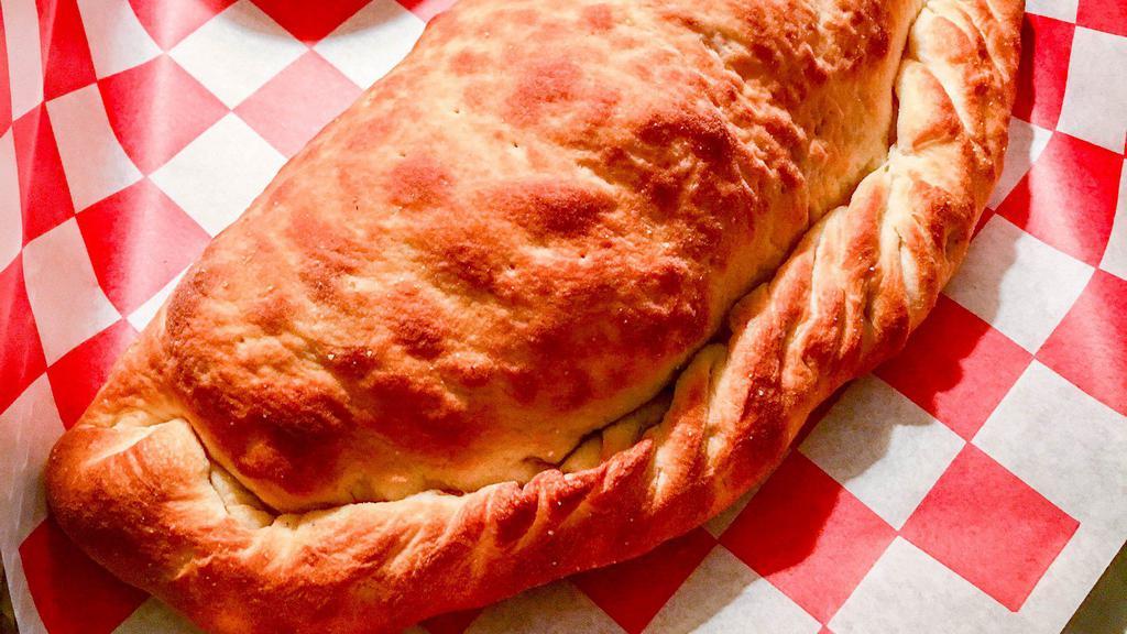 Calzone- Byo · Our homemade pizza dough stuffed with Mozzarella cheese and your choice of up to three ingredients, Served with a side of sauce.