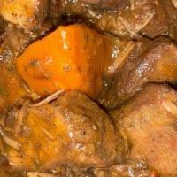 Brown Stew Chicken · No bones about this one. Chicken breast, thighs and carrots cooked down to tenderness.