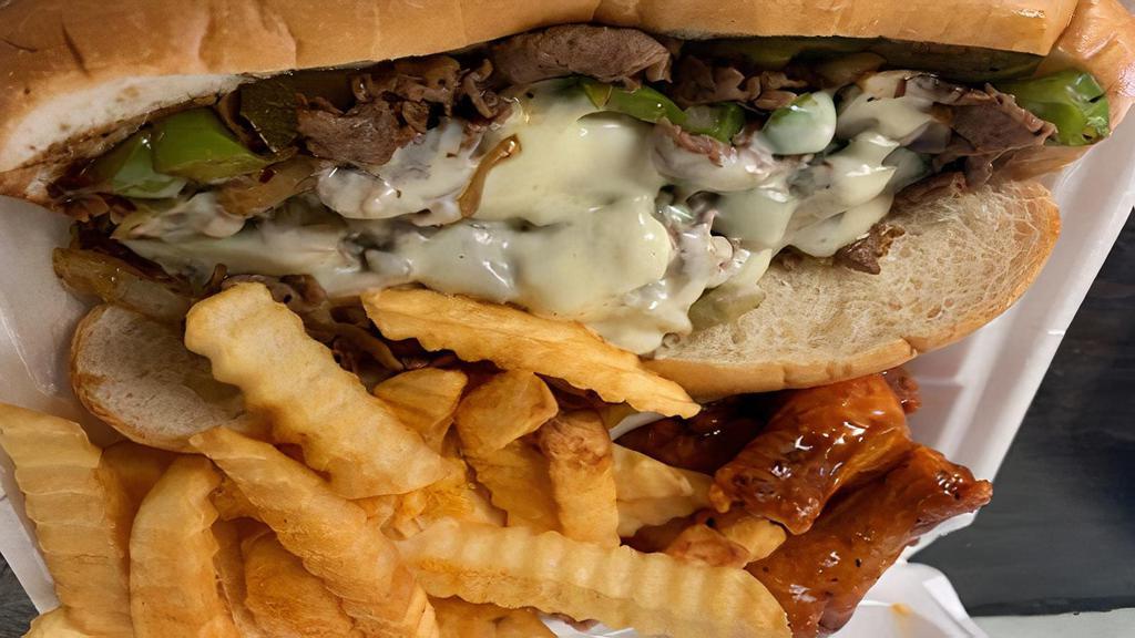 Philly Cheese Steak ( Fries, 4 Pieces Wings & Drink) · Comes with sandwich, fries, 4 Pieces wings and your choice of coca-cola product.