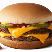 Double Cheeseburger  · It's topped with tangy and tasty pickles, chopped onions, ketchup, mustard and two slices of...