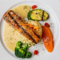 Grilled Pacific Salmon · Served over vegetables in a rosemary wine sauce.
