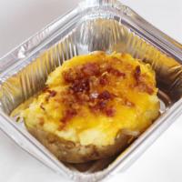 ½ Twice Stuff Baked Potato · Includes: Bacon, cheese, sour cream, butter.
