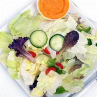 House Salad · Mixed green sesame or ginger dressing.