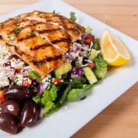 Grilled Salmon Greek Salad · A big greek salad with grilled salmon.