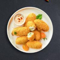 Jalapeno Poppers · (7 pieces) Fresh jalapenos coated in cream cheese and fried until golden brown.