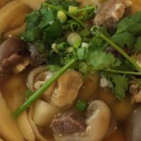 Lamb Noodle Stew /羊肉烩面 · Savory light broth with noodles.