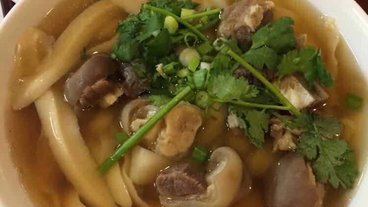Lamb Noodle Stew /羊肉烩面 · Savory light broth with noodles.