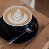 Cafe Latte · Shot of espresso poured over a large mug of steamed milk.