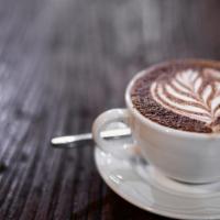 Cafe Mocha · Two shots of espresso mixed with freshly ground Mexican chocolate and topped with whipped cr...