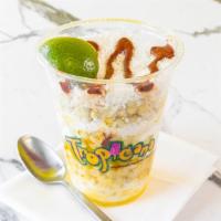 Corn In A Cup With Hot Cheetos  · Corn with Hot Cheeto Crumbs with Mayonnaise, Crema, and Melted Butter topped with Cotija Che...