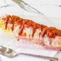 Corn On The Cob With Cheetos · Corn cob covered in mayonnaise, crema, butter, cotija cheese, and topped off with a layer of...