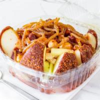 Prepared Crazy Apple · Chamoy covered apple cut in sliced covered in chamoy and Tajin, topped with jicama and cucum...