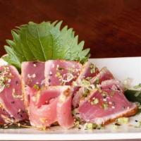 Garlic Pepper Tuna · 6 pieces of seared Hawaiian ahi tuna seasoned with garlic pepper and lemon vinaigrette.
