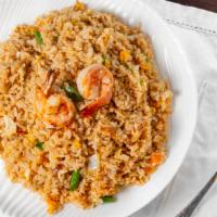 Shrimp Fried Rice · Steamed rice stir-fried in a wok with shrimp, onions, peas, green beans, carrots and corn.