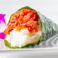 Spicy Tuna Hand Roll · Traditional one piece cone shaped hand roll with Chopped tuna and cucumber in spicy sauce.
