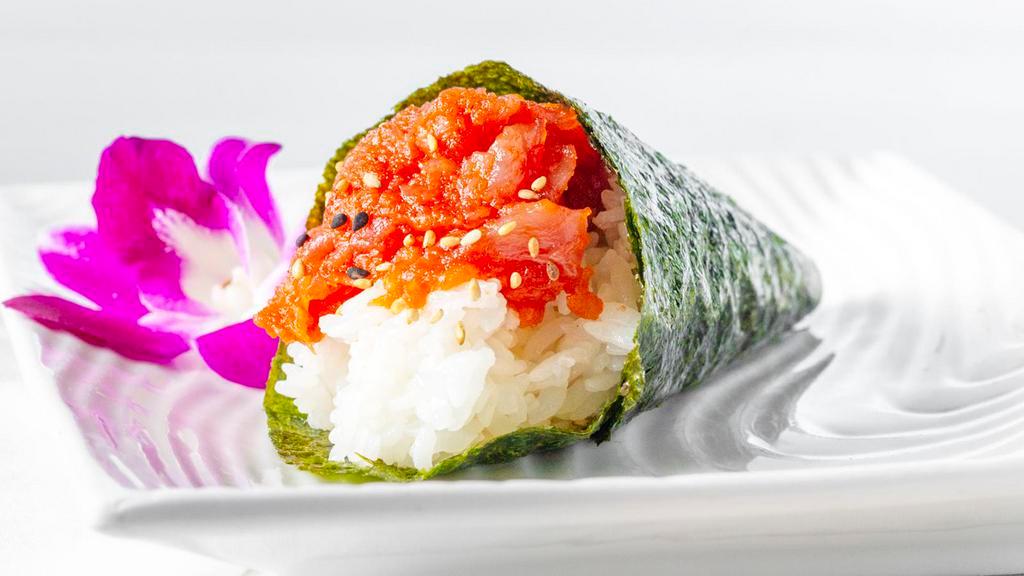 Spicy Tuna Hand Roll · Traditional one piece cone shaped hand roll with Chopped tuna and cucumber in spicy sauce.