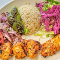Chicken Shish · Gluten free. Marinated char-grilled chicken cube served with rice and salad.