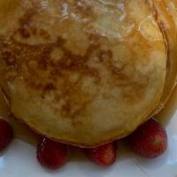 Pancakes  · Served with Eggs and cheese w/ honey ham or Fried baloney