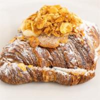Almond Frangipane Croissant  · Citrus Frangipane filled with blueberry compote and topped with almond clusters
