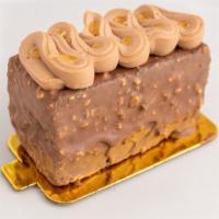 Choco Torta · Chocolate sponge with apricot jam layers, covered in milk chocolate hazelnut glaze, and topp...