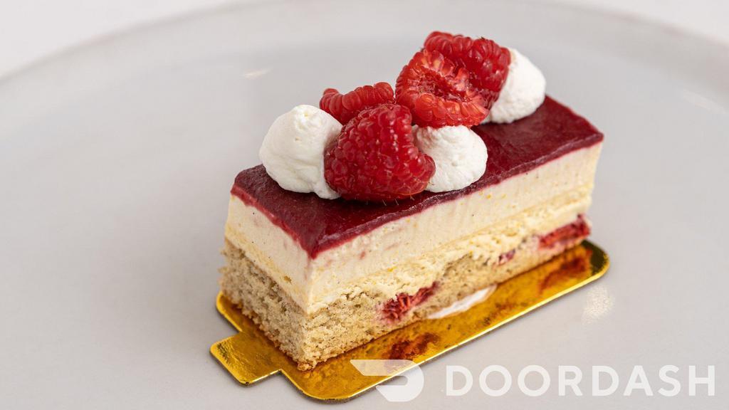 Raspberry Cheesecake · Raspberry brown butter cake, baked cheesecake, orange ricotta cream topped with raspberry gelee