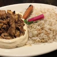 Chicken Shawarma · Marinated chicken charbroiled and sliced. Served with your choice of rice or fries and soup ...
