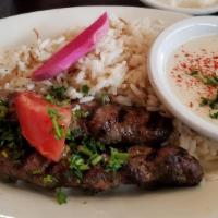 Chicken Kafra · Fresh ground chicken mixed with onions, parsley, and spices, skewered and charbroiled. Serve...