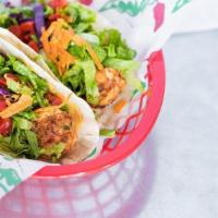 Grilled Fish Taco Combo · Two flour tortillas filled with grilled cod and our salad mix. Served with a side of Habaner...