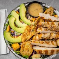 Tex-Mex Caesar Salad · Salad mix topped with fajita chicken, croutons, avocado slices, and fried jalapenos.