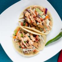 Grilled Fish Taco · Fresh wild-caught seasonal fish, cabbage,carrots, pico de gallo,andchipotle crema
