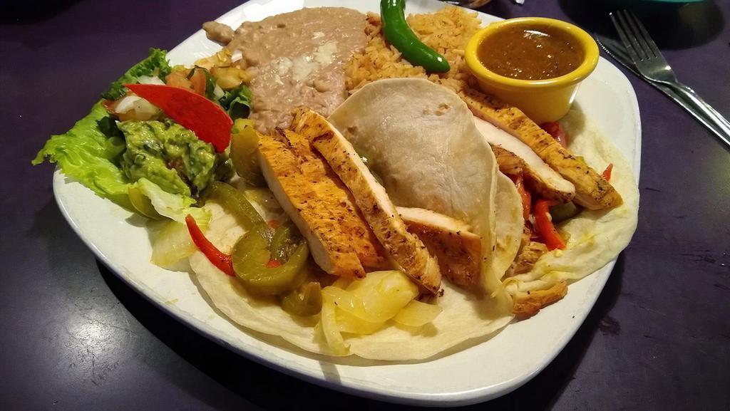 Chicken Fajita Tacos · Mesquite grilled chicken breast, sautéed bell peppers and onions, pico de gallo, and guacamole. Served with smoky ranchero salsa