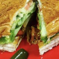 Torta/Pescado · Tilapa fillet, marinated in mexican adobo sauce, All the Tortas come with french bread, lett...