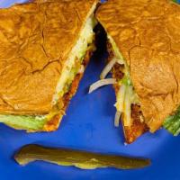Torta/Pollo · Chicken marinated in mexican adobo sauce, All the Tortas come with french bread, lettuce, av...