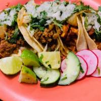 Pollo · Chicken Marinated with Mexican Adobo sauce, Each taco comes with corn tortilla's, Served wit...
