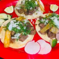 Lengua · Beef Tongue, Each taco comes with corn tortilla's, Served with cilantro, raw and grilled oni...