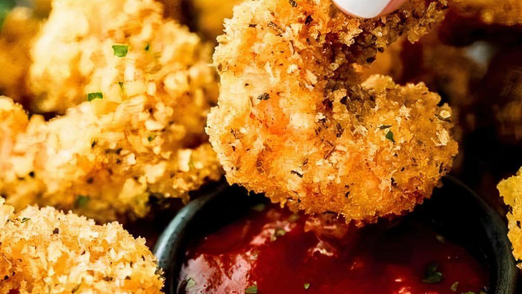 Popcorn Shrimp · Fresh mini shrimp battered and coated in seasonings then deep-fried to golden brown perfection.
