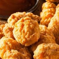 Chicken Bites · White Meat Chicken Tender Chunks deep fried to golden brown perfection.